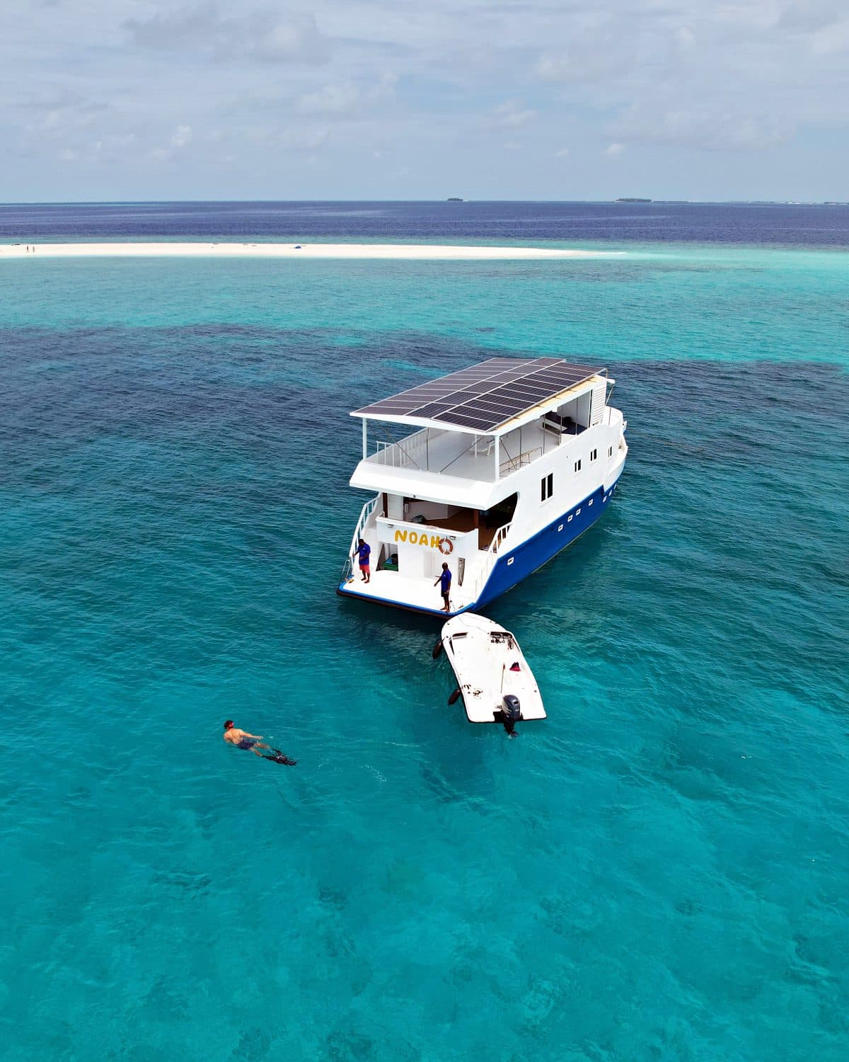 Guest snorkelling off NOAH's stern near a sandbank