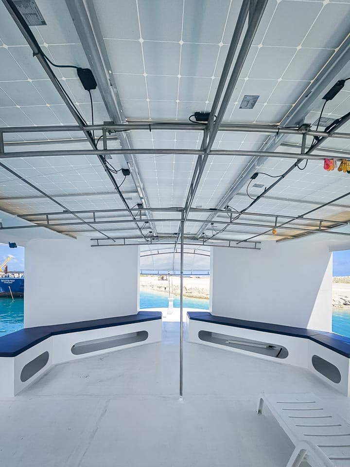 Covered deck benches beneath NOAH's solar-panel roof
