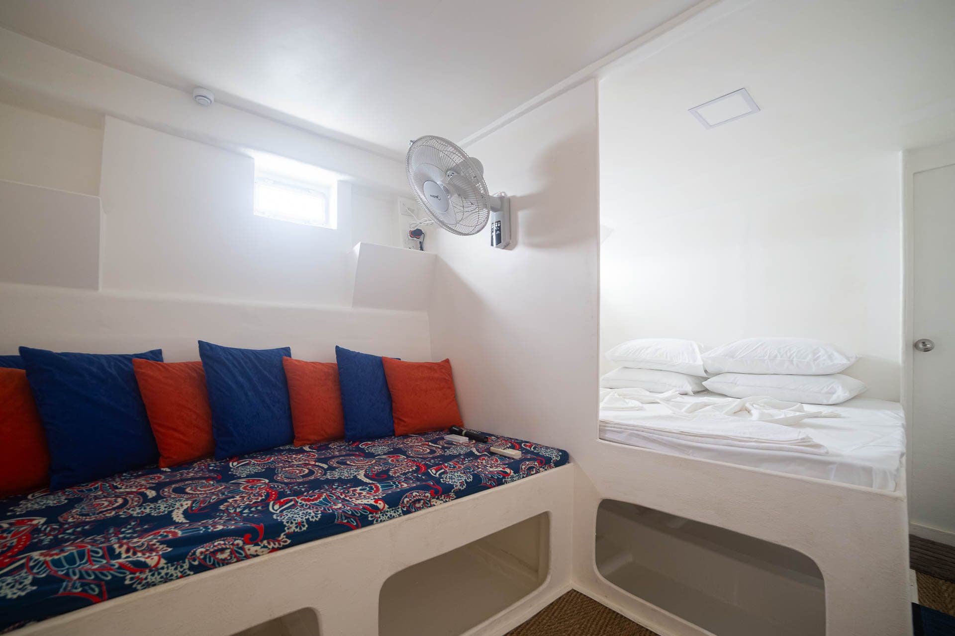 Bright double cabin on NOAH with wall fan and window