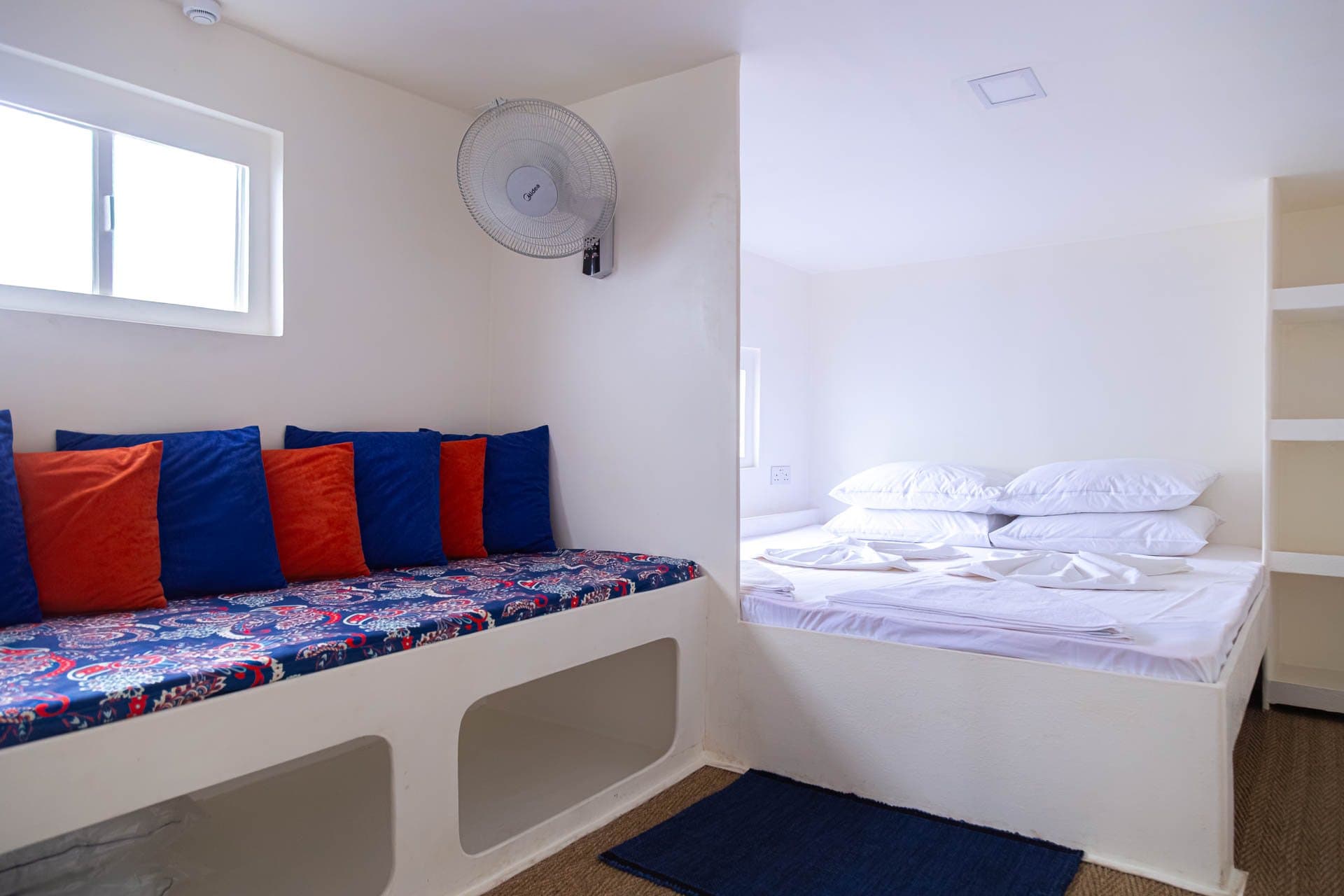 Refitted cabin on NOAH with double bed and cushioned sofa bed
