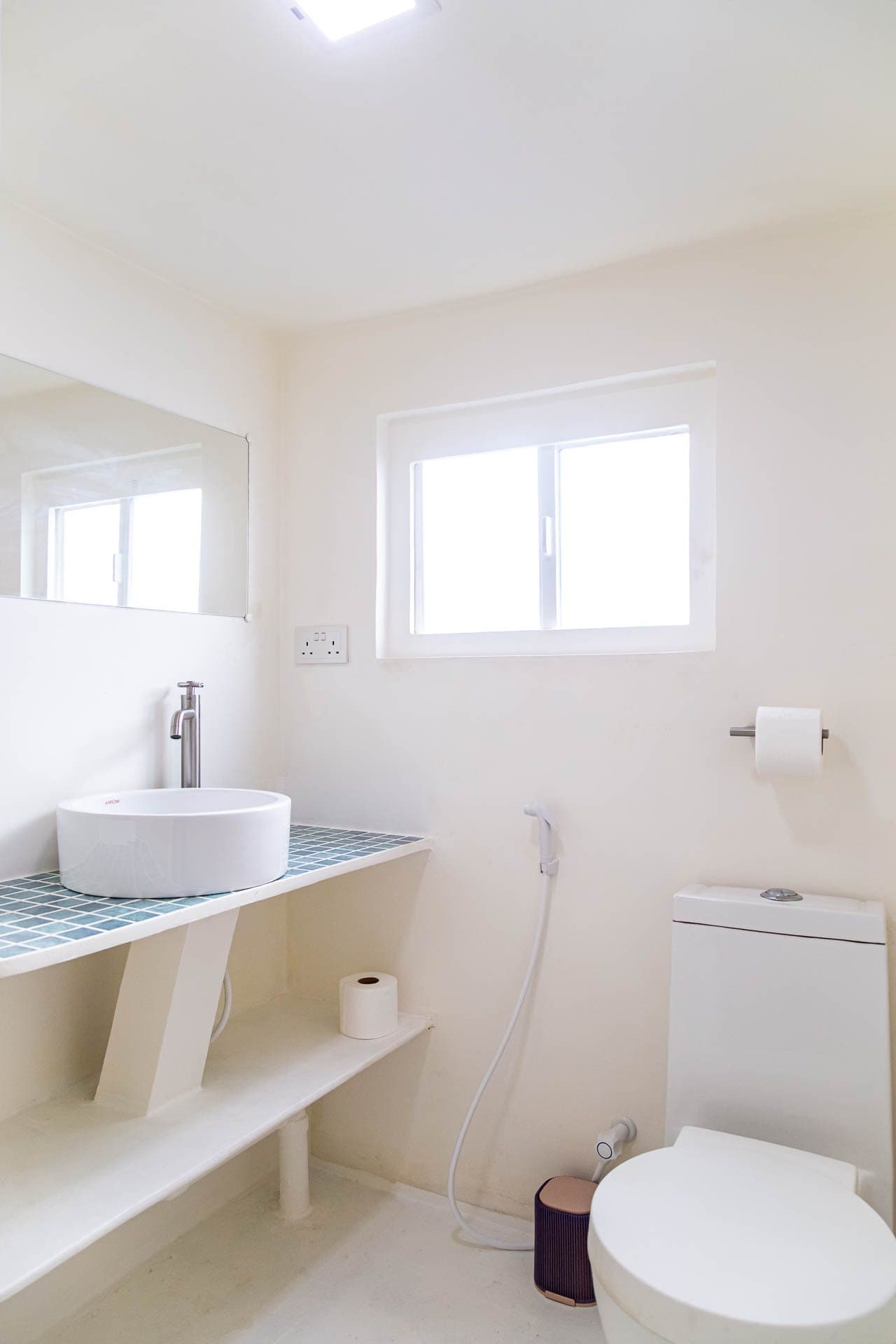 En-suite bathroom with basin and toilet in a NOAH cabin