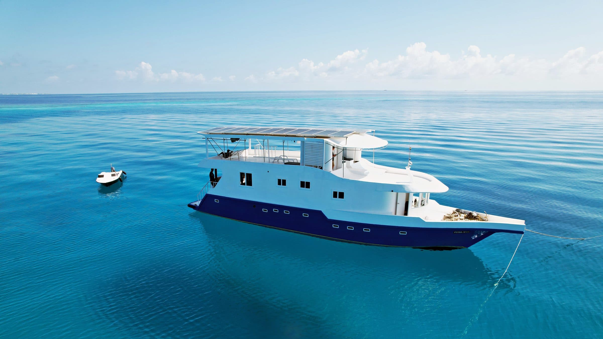 The NOAH safari boat at anchor in clear turquoise Maldivian water