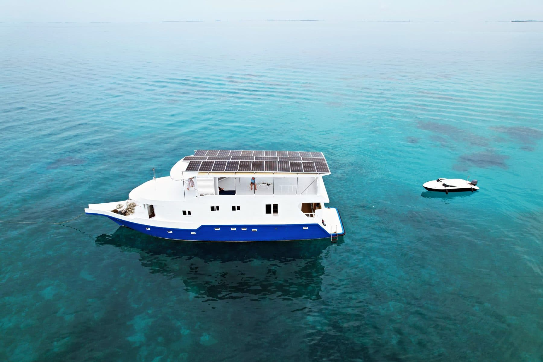 NOAH's solar-panel top deck over turquoise water