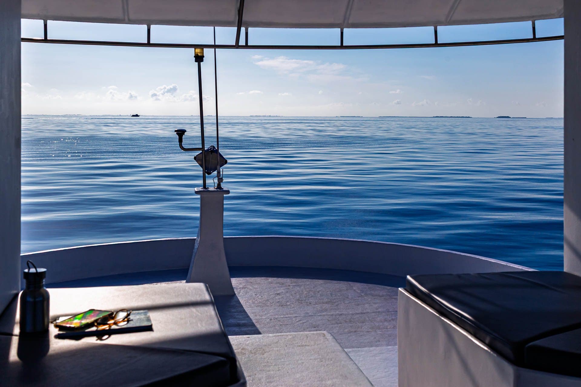 Shaded bow seating on NOAH looking out over a calm sea